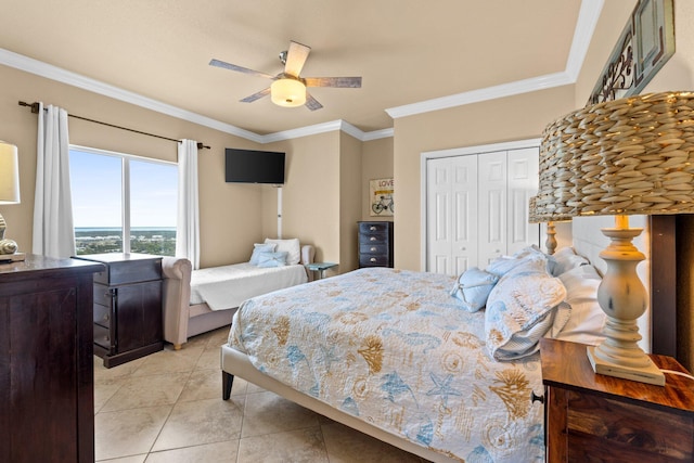 16819 Front Beach Rd Unit 2300, Panama City Beach, FL 32413 - bedroom with light tile patterned floors, a closet, ornamental molding, and a ceiling fan