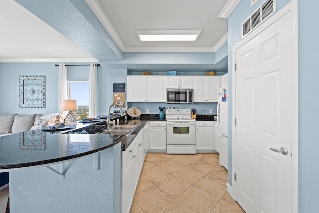 16819 Front Beach Rd Unit 2300, Panama City Beach, FL 32413 - kitchen featuring white appliances, a sink, a peninsula, white cabinetry, and ornamental molding