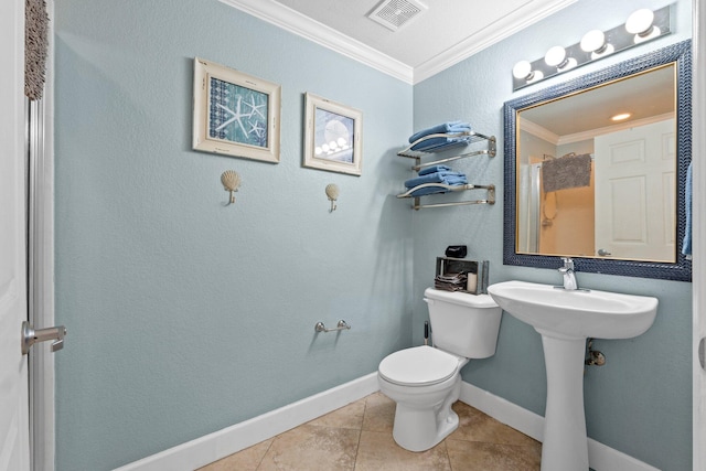 16819 Front Beach Rd Unit 2300, Panama City Beach, FL 32413 - bathroom with toilet, ornamental molding, tile patterned floors, and baseboards