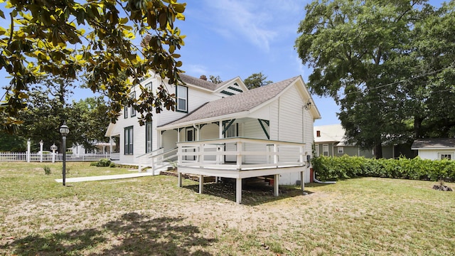 119 E Live Oak Ave, Defuniak Springs, FL 32435 - rear view of house featuring a shingled roof and a deck