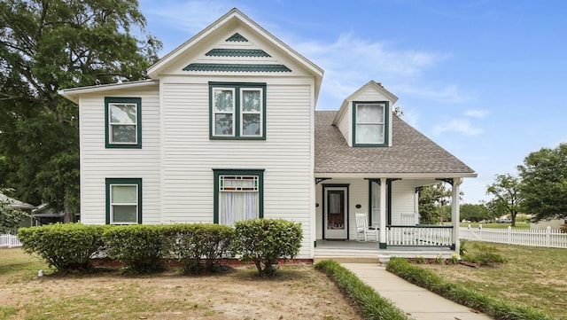 119 E Live Oak Ave, Defuniak Springs, FL 32435 - victorian-style house with covered porch and roof with shingles