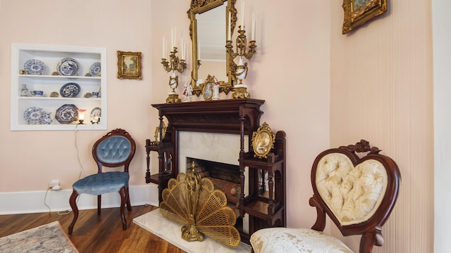 119 E Live Oak Ave, Defuniak Springs, FL 32435 - sitting room with wood finished floors and baseboards