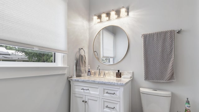 119 E Live Oak Ave, Defuniak Springs, FL 32435 - bathroom featuring vanity and toilet