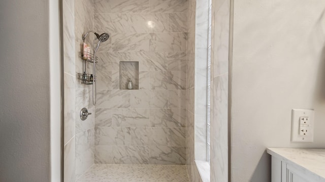 119 E Live Oak Ave, Defuniak Springs, FL 32435 - bathroom featuring a tile shower and vanity