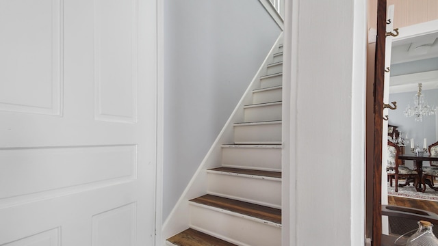 119 E Live Oak Ave, Defuniak Springs, FL 32435 - stairs with a chandelier