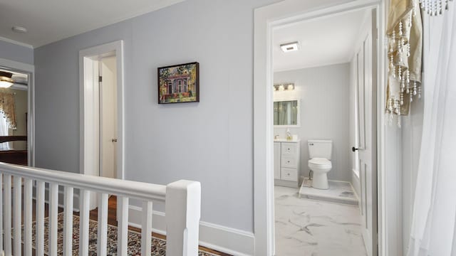 119 E Live Oak Ave, Defuniak Springs, FL 32435 - hallway with marble finish flooring and ornamental molding