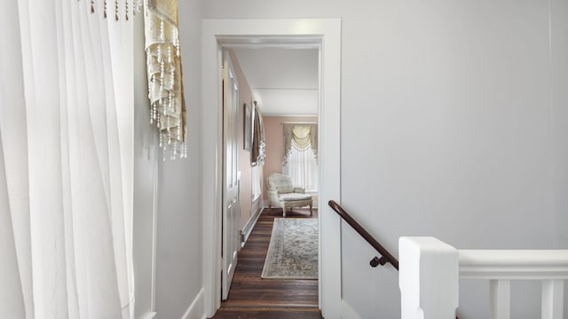 119 E Live Oak Ave, Defuniak Springs, FL 32435 - corridor with dark wood-style floors and an upstairs landing