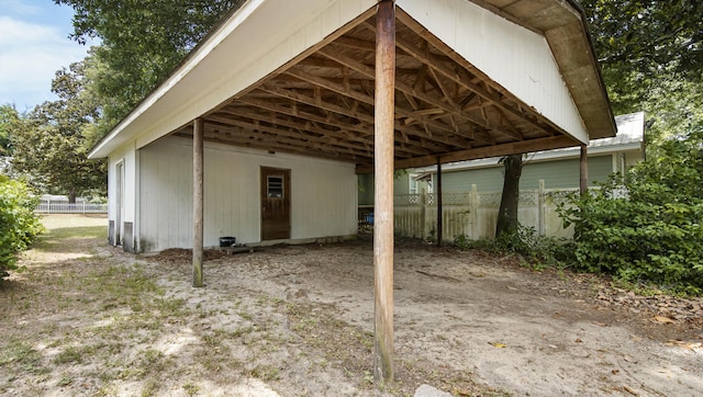 119 E Live Oak Ave, Defuniak Springs, FL 32435 - view of outdoor structure featuring a carport and dirt driveway