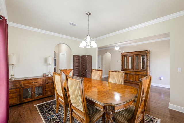 170 Windchime Way, Freeport, FL 32439 - dining room with arched walkways, hardwood / wood-style floors, baseboards, and ornamental molding