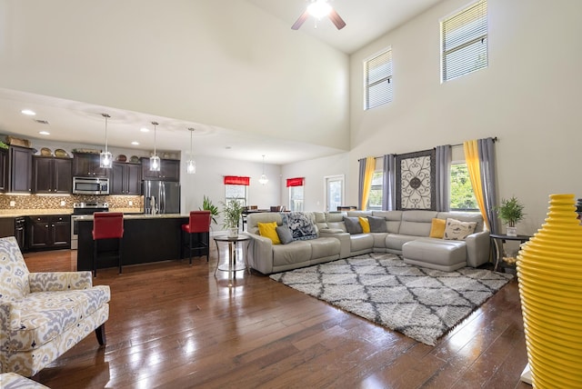 170 Windchime Way, Freeport, FL 32439 - living area featuring ceiling fan, dark wood-type flooring, and a high ceiling