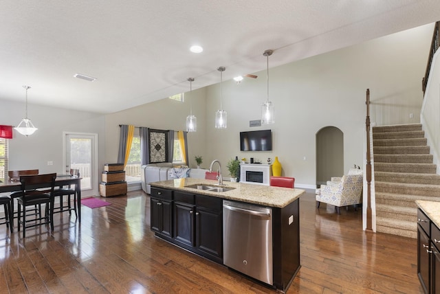 170 Windchime Way, Freeport, FL 32439 - kitchen with dishwasher, a sink, open floor plan, dark wood-style floors, and arched walkways
