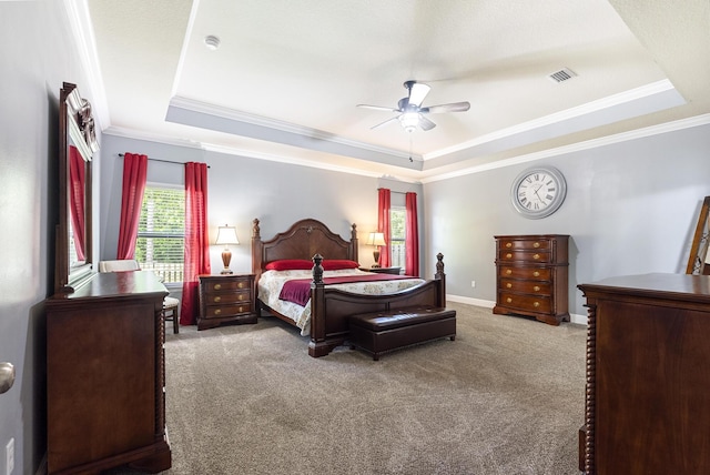 170 Windchime Way, Freeport, FL 32439 - carpeted bedroom featuring a tray ceiling, ornamental molding, a ceiling fan, and baseboards