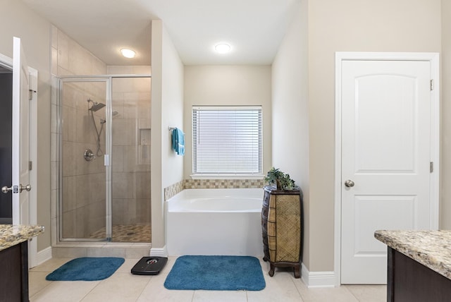 170 Windchime Way, Freeport, FL 32439 - bathroom featuring vanity, a garden tub, a stall shower, and tile patterned floors