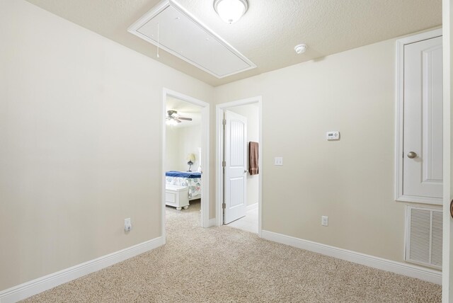170 Windchime Way, Freeport, FL 32439 - empty room featuring attic access, light carpet, baseboards, and a smoke detector