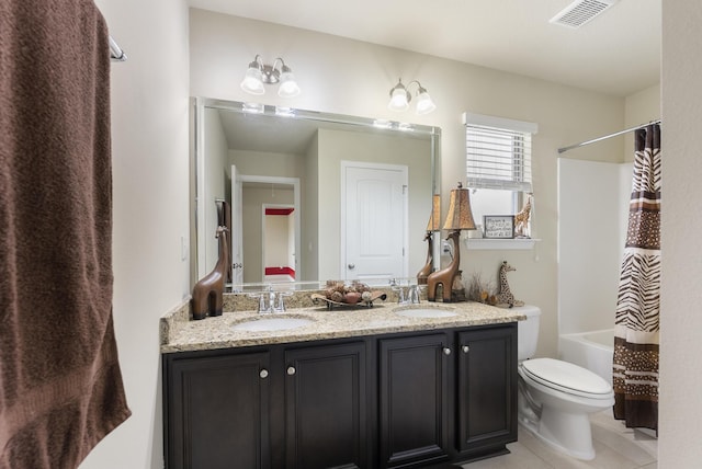 170 Windchime Way, Freeport, FL 32439 - bathroom with double vanity, toilet, tile patterned floors, and shower / bathtub combination with curtain