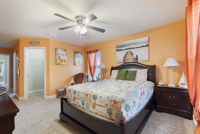 170 Windchime Way, Freeport, FL 32439 - carpeted bedroom with a spacious closet, baseboards, a ceiling fan, and a closet
