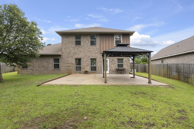 170 Windchime Way, Freeport, FL 32439 - back of house featuring a gazebo, a patio, brick siding, and board and batten siding
