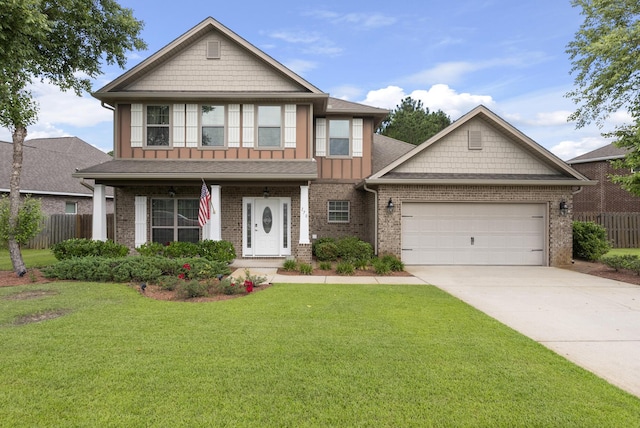 170 Windchime Way, Freeport, FL 32439 - view of front of property featuring board and batten siding, a garage, driveway, brick siding, and covered porch