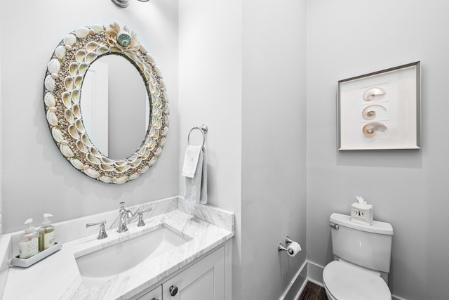 667 E Royal Fern Way, Santa Rosa Beach, FL 32459 - half bathroom with toilet, vanity, and baseboards