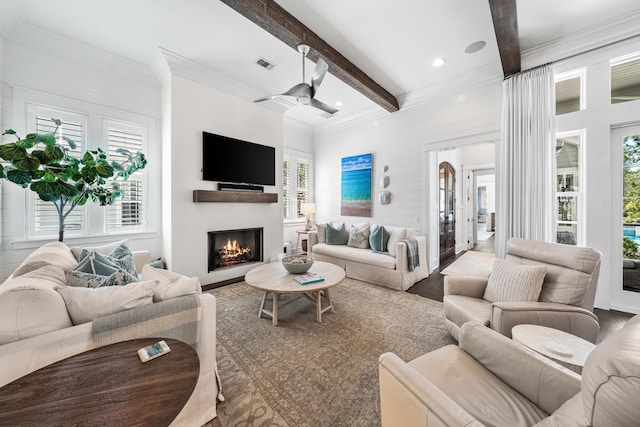 667 E Royal Fern Way, Santa Rosa Beach, FL 32459 - living area with beam ceiling, ceiling fan, ornamental molding, a warm lit fireplace, and plenty of natural light