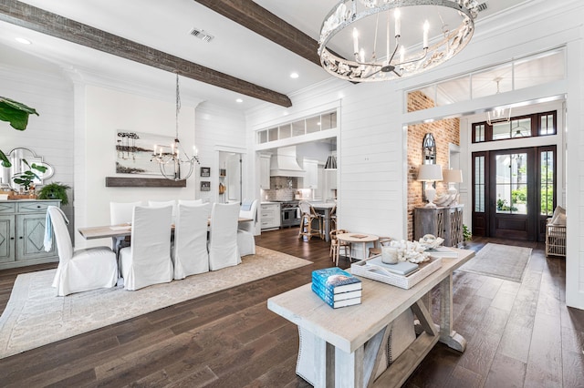 667 E Royal Fern Way, Santa Rosa Beach, FL 32459 - living room featuring a chandelier, dark wood-style floors, beam ceiling, wooden walls, and a high ceiling