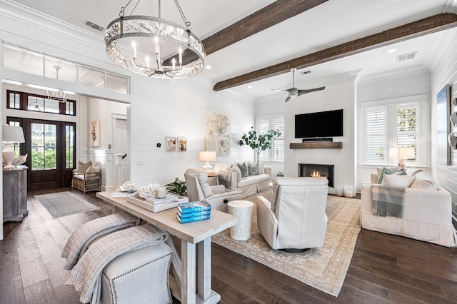 667 E Royal Fern Way, Santa Rosa Beach, FL 32459 - living area with dark wood-style flooring, plenty of natural light, beam ceiling, a chandelier, and a warm lit fireplace