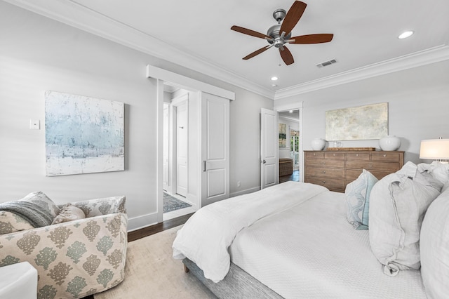 667 E Royal Fern Way, Santa Rosa Beach, FL 32459 - bedroom with wood finished floors, crown molding, recessed lighting, ceiling fan, and baseboards