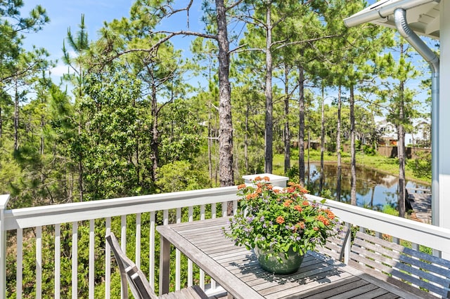 667 E Royal Fern Way, Santa Rosa Beach, FL 32459 - wooden terrace with a water view and view of wooded area