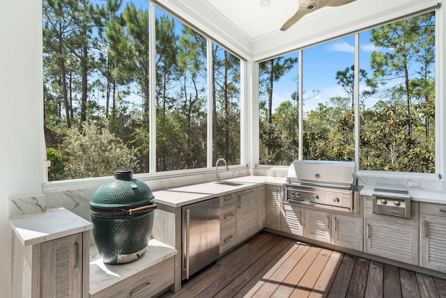 667 E Royal Fern Way, Santa Rosa Beach, FL 32459 - unfurnished sunroom with exterior kitchen, ceiling fan, and a sink