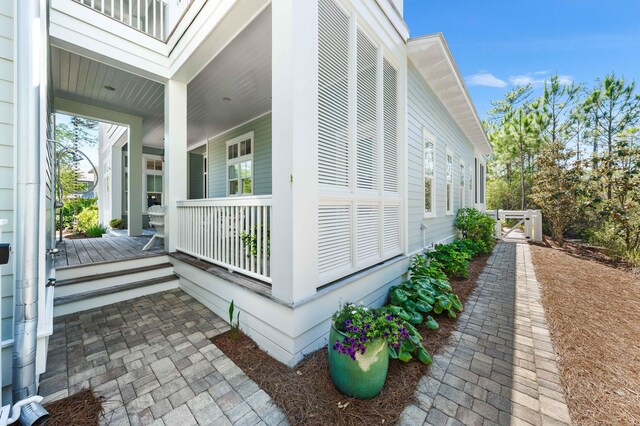 667 E Royal Fern Way, Santa Rosa Beach, FL 32459 - view of side of home with covered porch and a gate