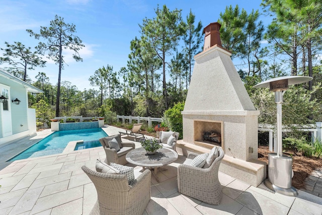 667 E Royal Fern Way, Santa Rosa Beach, FL 32459 - view of patio featuring an outdoor fireplace and an outdoor pool