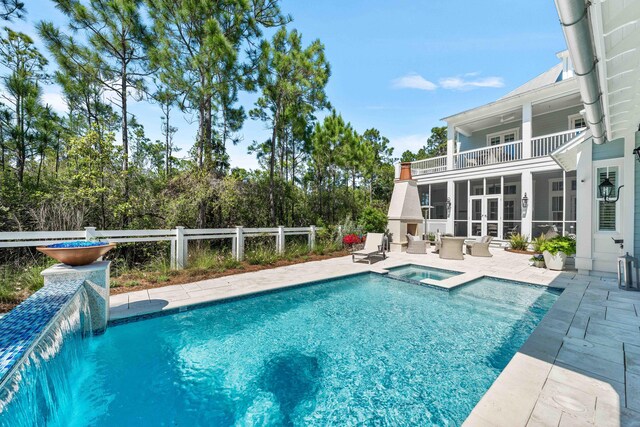 667 E Royal Fern Way, Santa Rosa Beach, FL 32459 - view of pool with a patio, a pool with connected hot tub, a sunroom, and outdoor lounge area