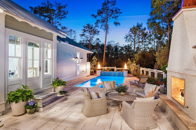 667 E Royal Fern Way, Santa Rosa Beach, FL 32459 - swimming pool featuring a patio area and exterior fireplace