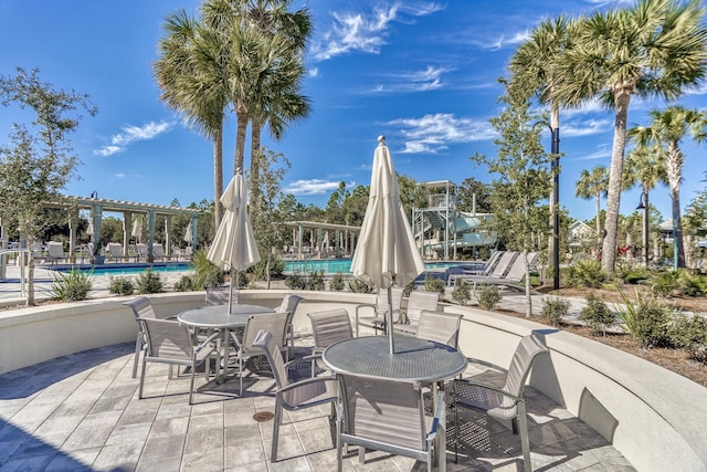 667 E Royal Fern Way, Santa Rosa Beach, FL 32459 - view of patio / terrace with a pergola and a community pool