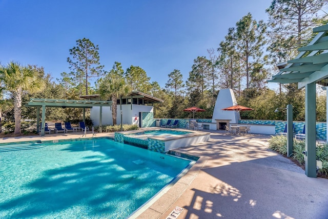 667 E Royal Fern Way, Santa Rosa Beach, FL 32459 - view of pool featuring a pergola, a patio area, and a pool with connected hot tub