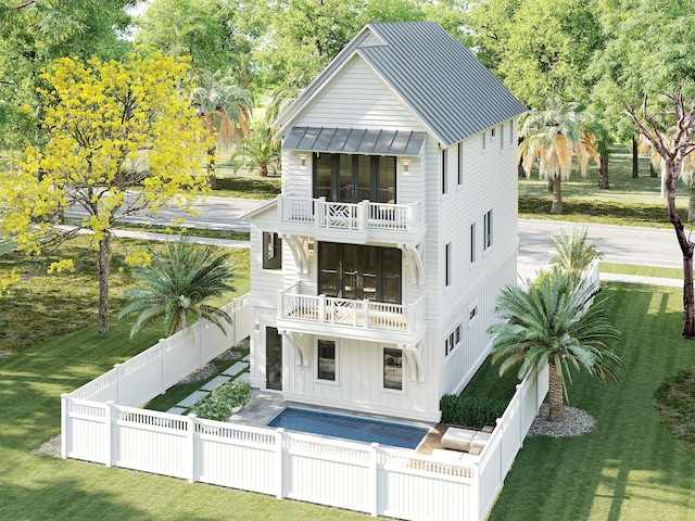 55 Grande Pointe Dr, Inlet Beach, FL 32461 - back of property featuring a balcony, a standing seam roof, a patio, metal roof, and view of wooded area