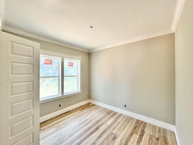298 S 2nd St, Santa Rosa Beach, FL 32459 - spare room with ornamental molding, light wood-type flooring, and baseboards