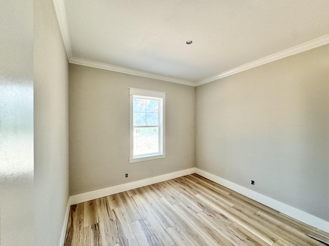 298 S 2nd St, Santa Rosa Beach, FL 32459 - unfurnished room with wood finished floors, baseboards, and ornamental molding