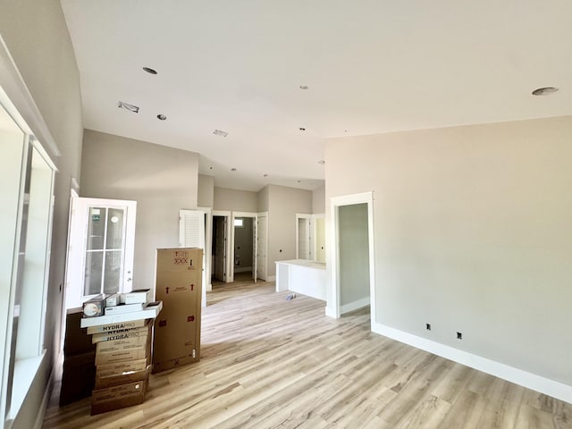 298 S 2nd St, Santa Rosa Beach, FL 32459 - unfurnished room with light wood-style floors, baseboards, vaulted ceiling, and recessed lighting