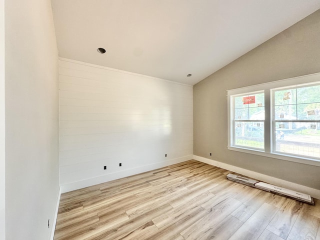 298 S 2nd St, Santa Rosa Beach, FL 32459 - empty room with lofted ceiling, light wood finished floors, and baseboards