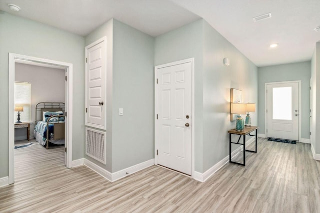 718 Backwater Rd, Port St Joe, FL 32456 - foyer featuring light wood-type flooring and baseboards