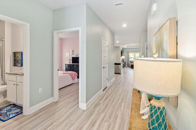 718 Backwater Rd, Port St Joe, FL 32456 - hall featuring light wood finished floors, baseboards, and recessed lighting