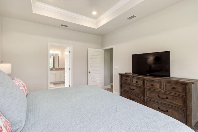 718 Backwater Rd, Port St Joe, FL 32456 - bedroom featuring a tray ceiling, crown molding, and ensuite bathroom