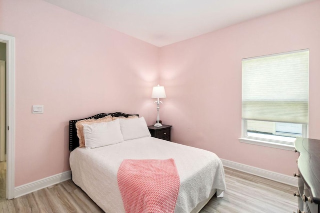 718 Backwater Rd, Port St Joe, FL 32456 - bedroom featuring baseboards and wood finished floors