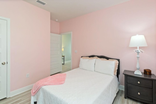 718 Backwater Rd, Port St Joe, FL 32456 - bedroom with light wood-style flooring and baseboards