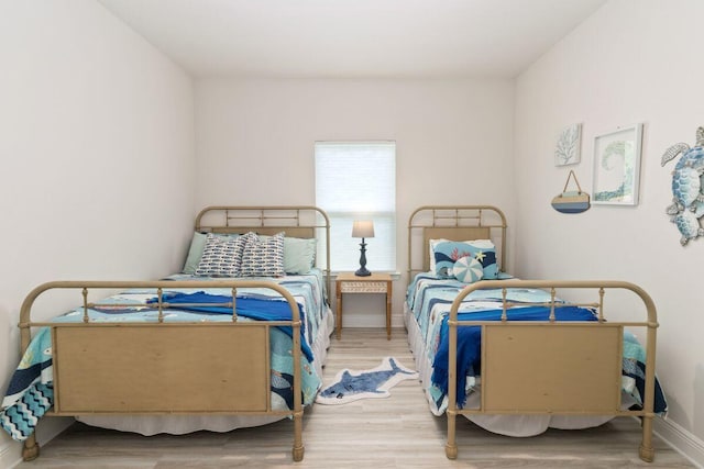 718 Backwater Rd, Port St Joe, FL 32456 - bedroom featuring wood finished floors and baseboards
