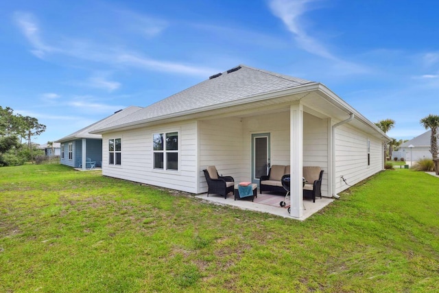 718 Backwater Rd, Port St Joe, FL 32456 - rear view of property with a patio area, outdoor lounge area, and a lawn