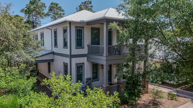 51 W Okeechobee, Santa Rosa Beach, FL 32459 - view of home's exterior with a balcony and metal roof