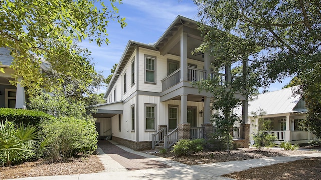 51 W Okeechobee, Santa Rosa Beach, FL 32459 - view of front of property with covered porch, a balcony, and board and batten siding