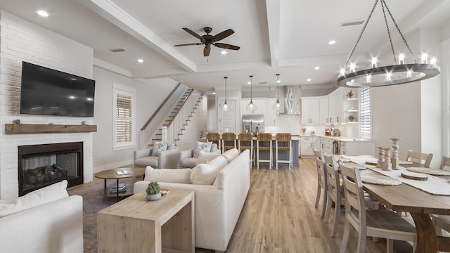 51 W Okeechobee, Santa Rosa Beach, FL 32459 - living room with a ceiling fan, light wood-style flooring, crown molding, stairs, and beamed ceiling